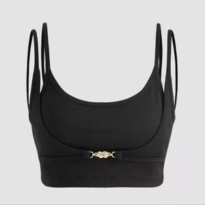 NWT, crop top black with gold clasp detail. Size small.